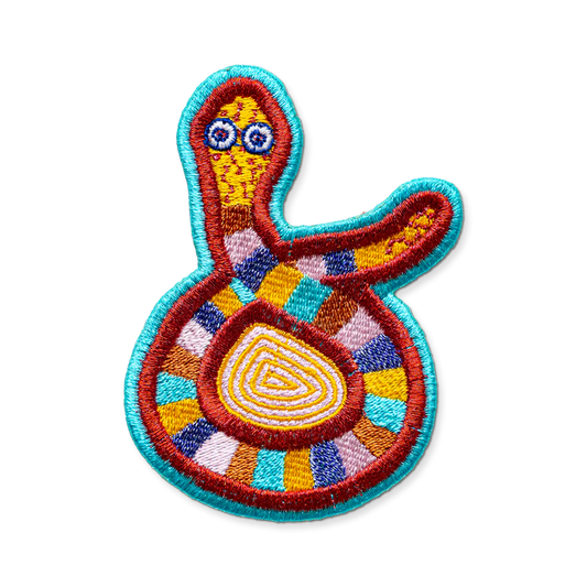 Colorful embroidered patch with abstract design on a white background