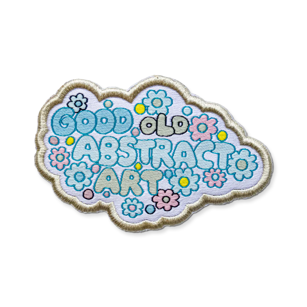 Decorative patch with 'Good Old Abstract Art' text and floral designs on a white background