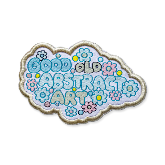 Decorative patch with 'Good Old Abstract Art' text and floral designs on a white background
