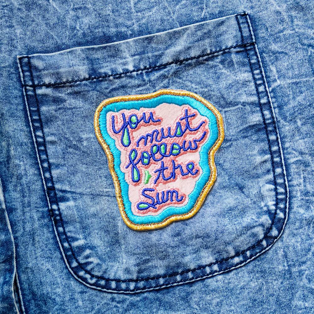 You Must Follow The Sun Iron-on Patch by Jeffrey Gibson
