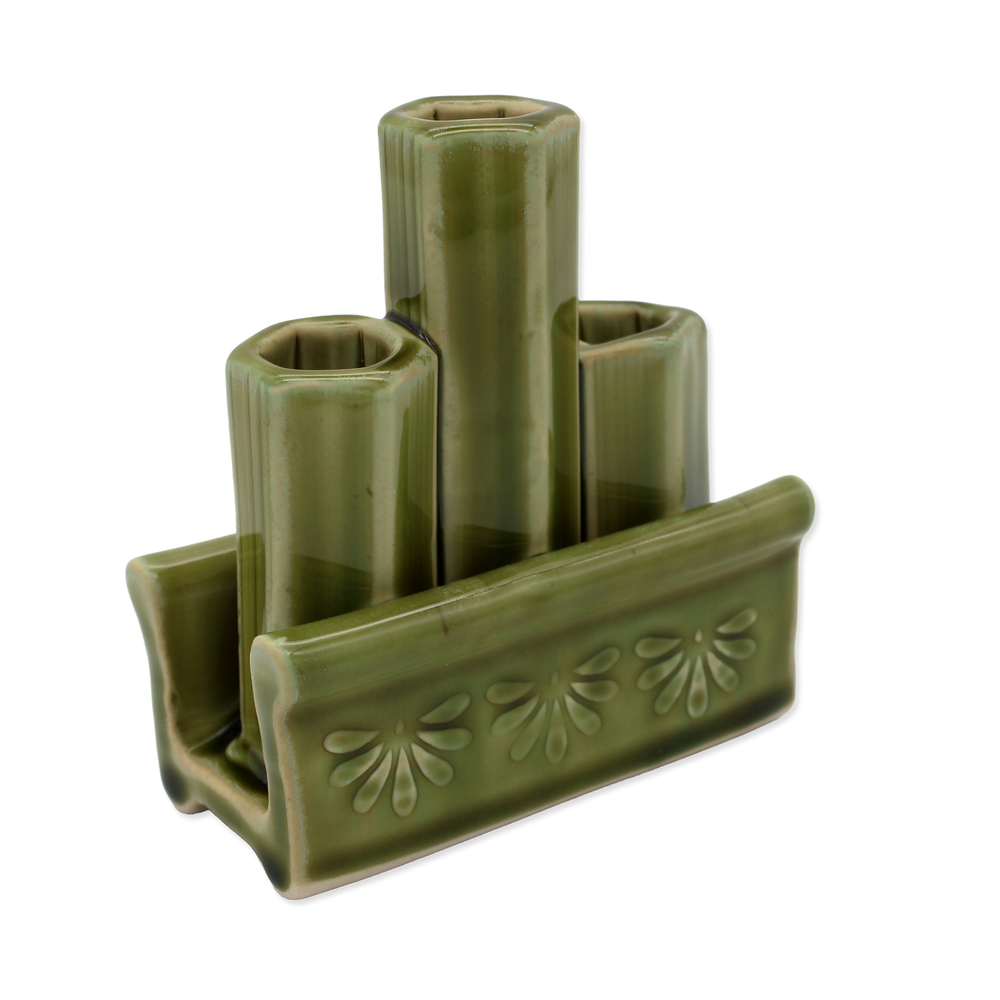 Green ceramic holder with three cylindrical slots on a white background
