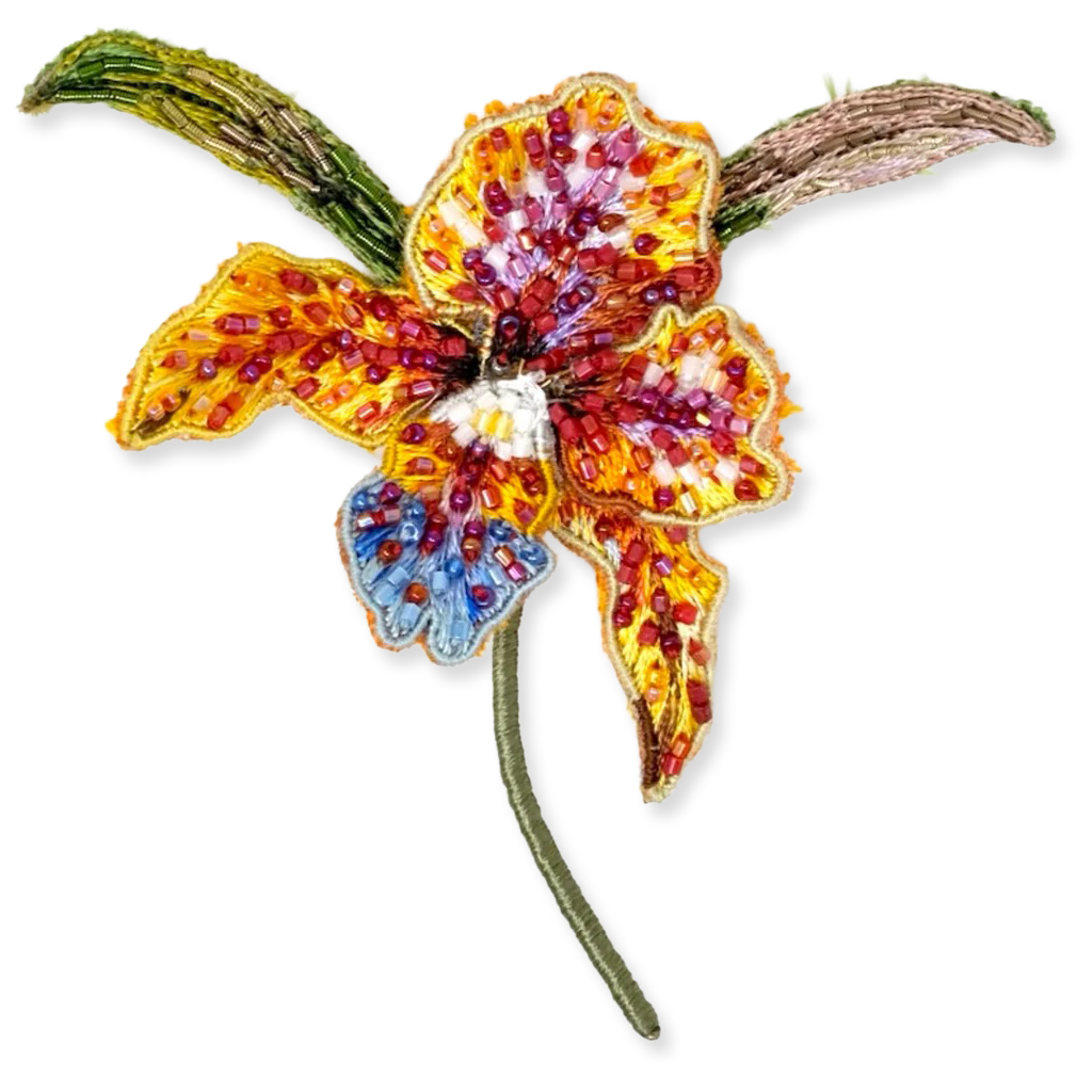 Colorful beaded flower brooch on a white background