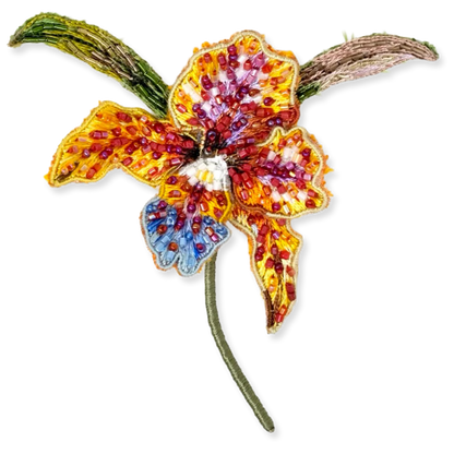 Colorful beaded flower brooch on a white background