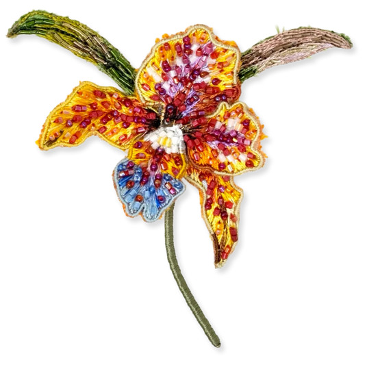 Colorful beaded flower brooch on a white background