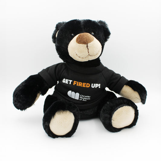 Rufus, the black teddy bear wearing his Chrysler Museum Glass Studio "Get Fired Up!" T-shirt - Chrysler Shop