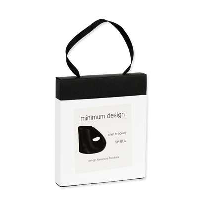 Black shell bracelet in a 'minimum design' packaging box on a white background