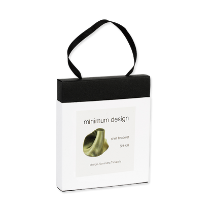 White packaging box with black handle featuring 'minimum design' and a shell bracelet illustration.