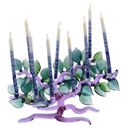 Decorative candle holder shaped like a tree with candles on a white background