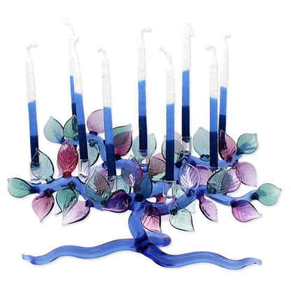 Decorative candle holder with blue and purple leaves on a white background