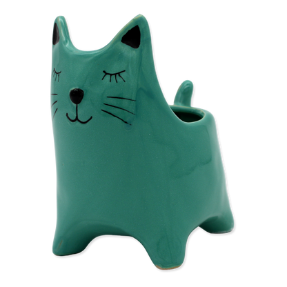 Green cat-shaped vase on a white background
