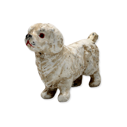 Vintage cast iron white Maltese dog figurine on a white background