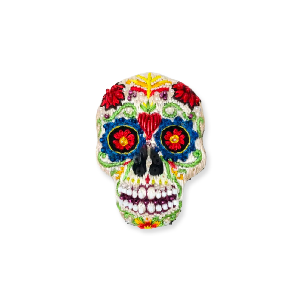 Colorful sugar skull decoration on a white background