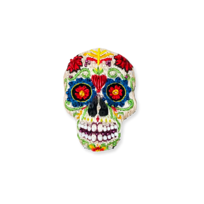 Colorful sugar skull decoration on a white background