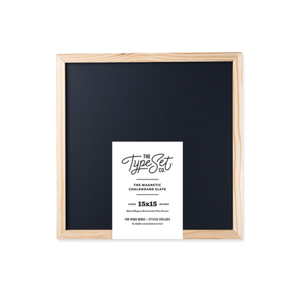 Framed black chalkboard with a white label on a white background