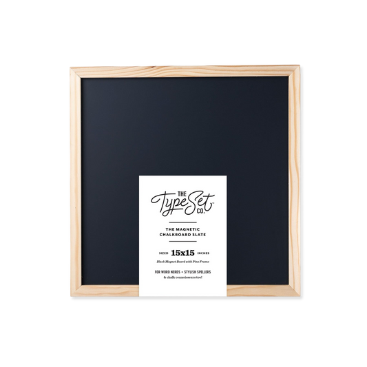 Framed black chalkboard with a white label on a white background
