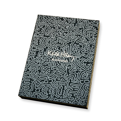 Notebook with a black and white patterned cover on a white background