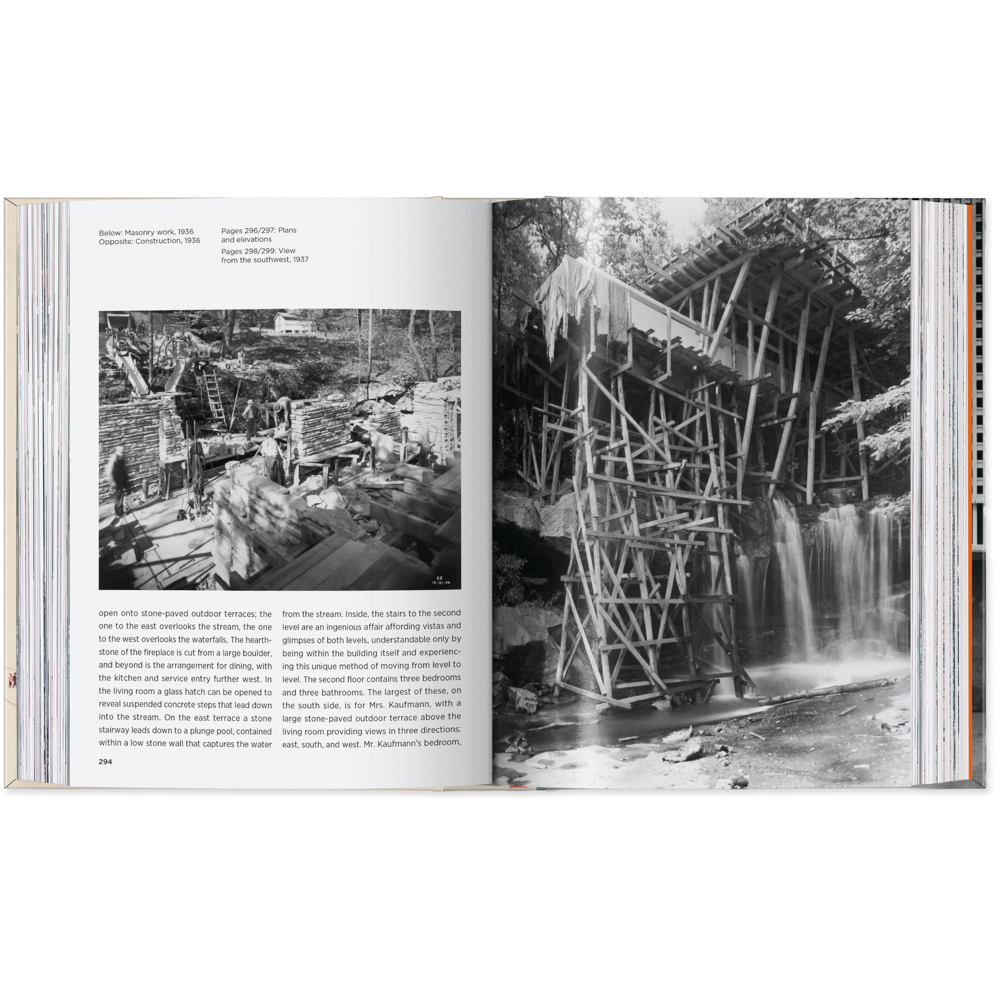 Open book showing black and white photographs of a wooden structure over a waterfall.