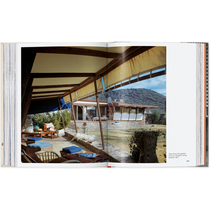Open book showing a photograph of a modern outdoor living space with mountains in the background.