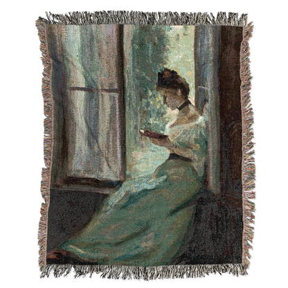 Woven blanket with a woman reading by a window design