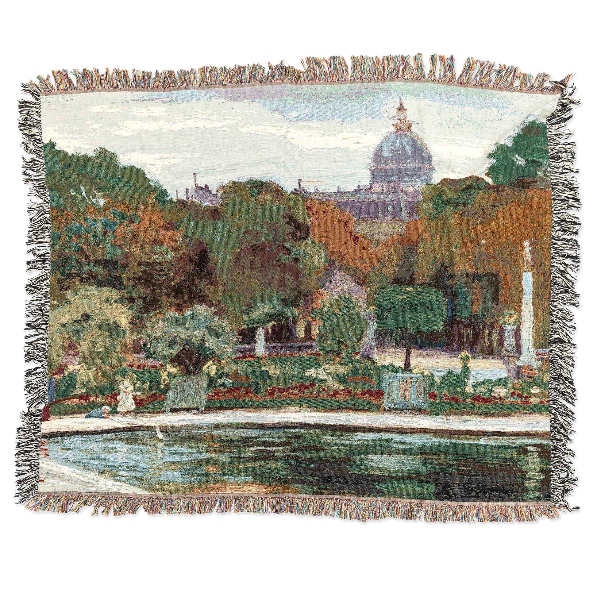 Woven blanket with a scenic landscape design featuring trees, buildings, and a pond.