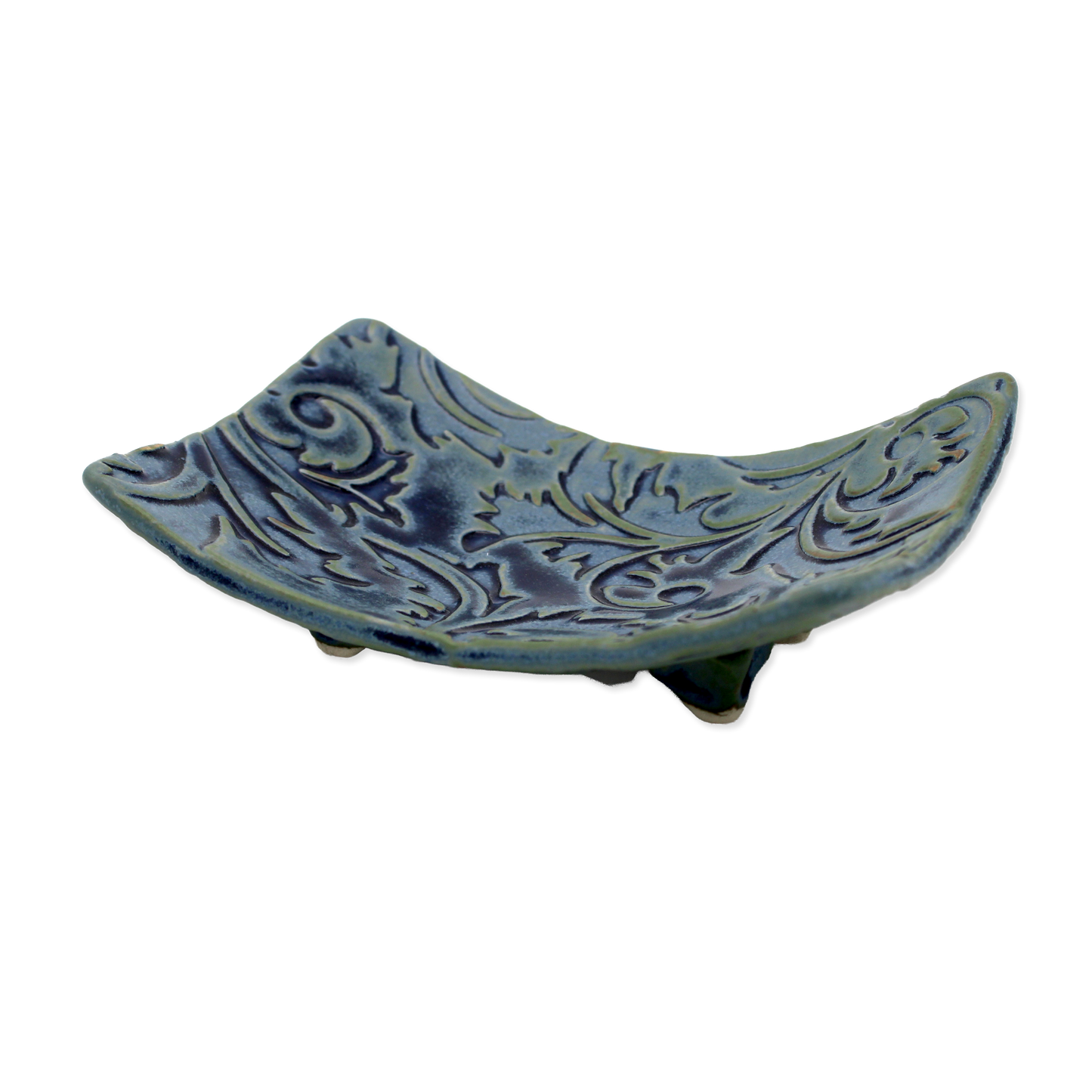 Decorative blue ceramic soap dish with intricate patterns on a white background