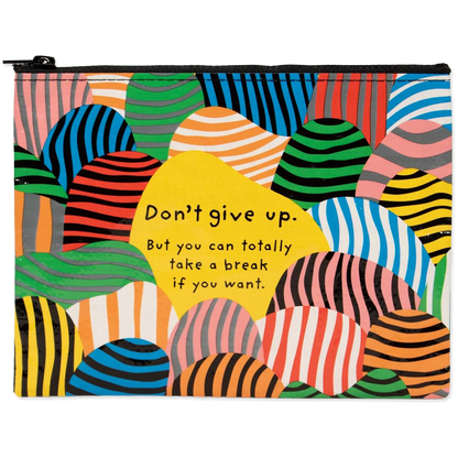 Colorful pouch with abstract patterns and motivational quote on a white background