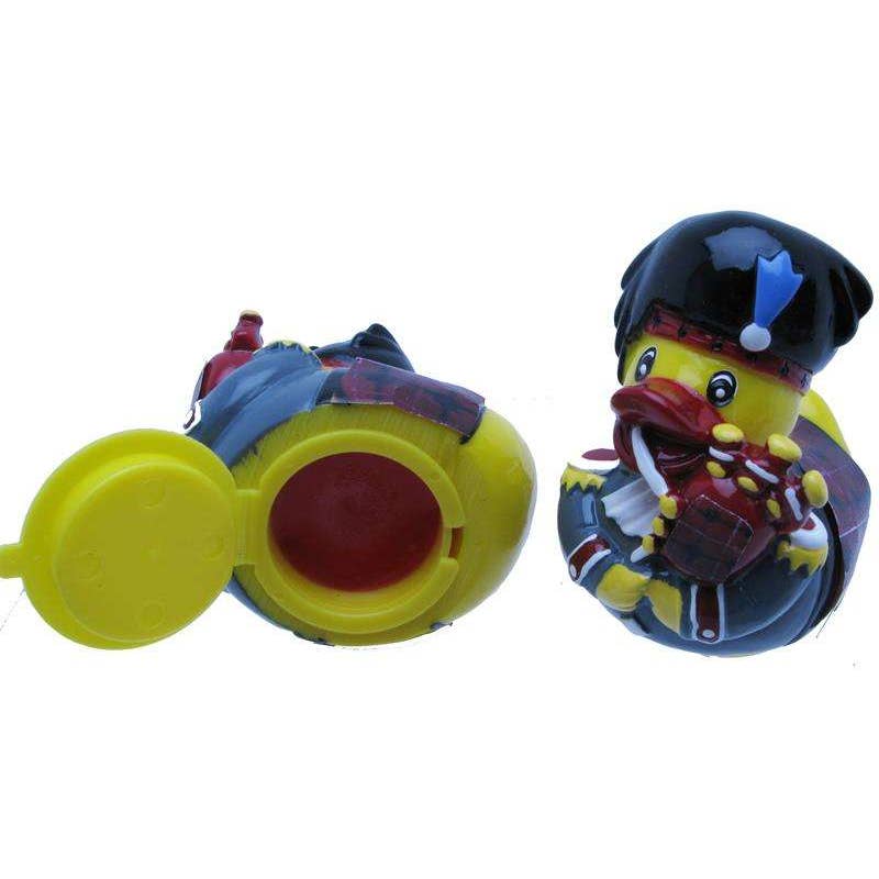 Toy figure of a duck in a in a kilt playing a bagpipe.