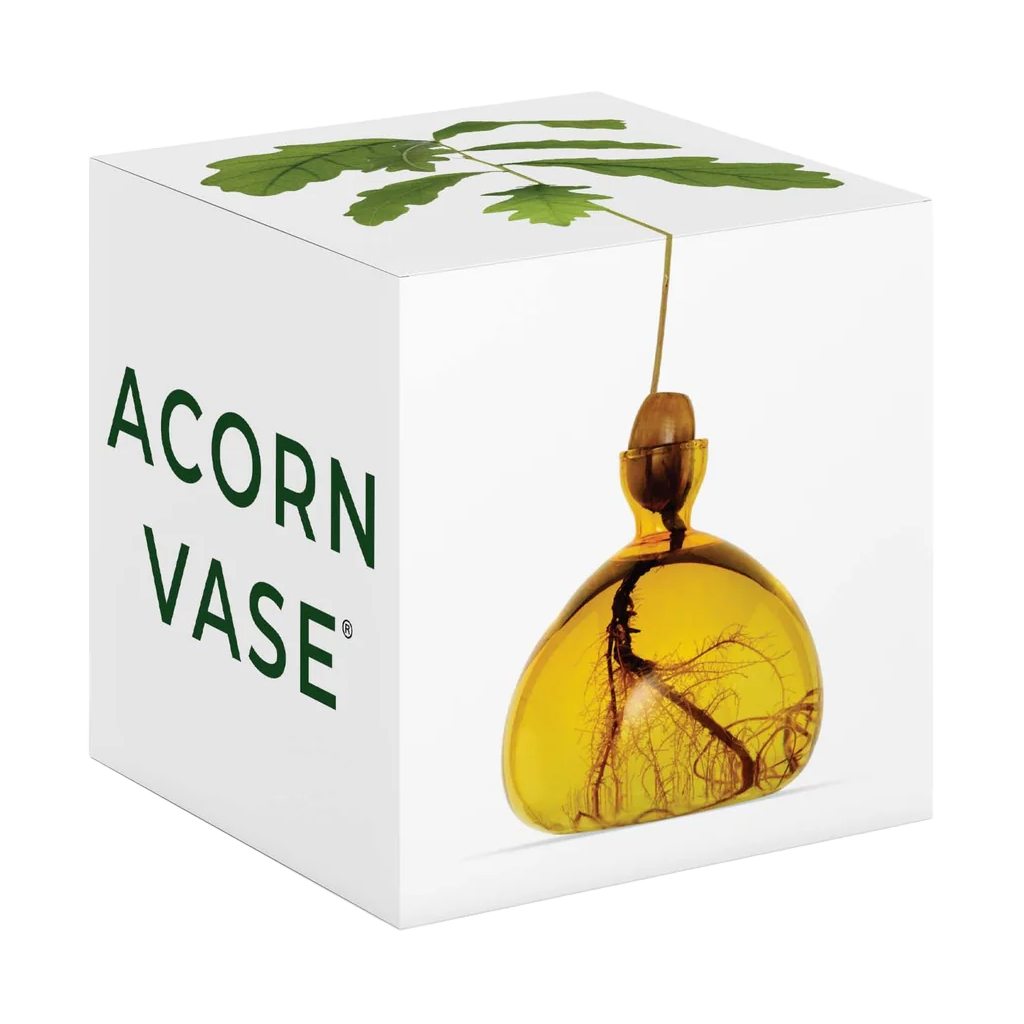 Yellow glass vase with tree design in a white box labeled 'Acorn Vase'.