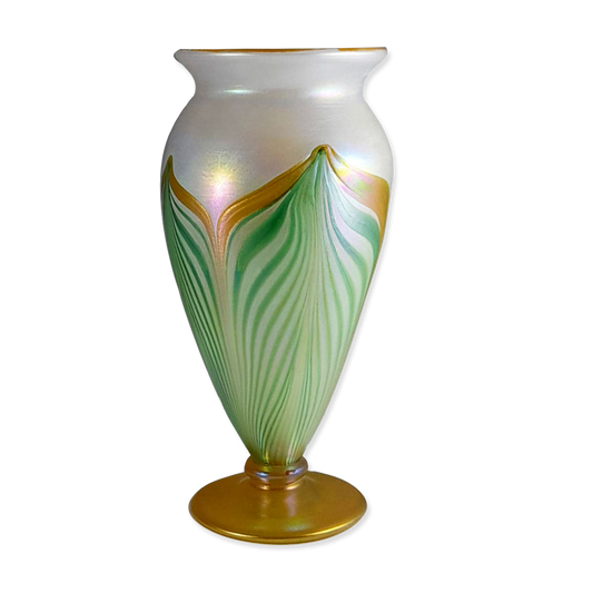 Decorative vase with green and gold patterns on a white background