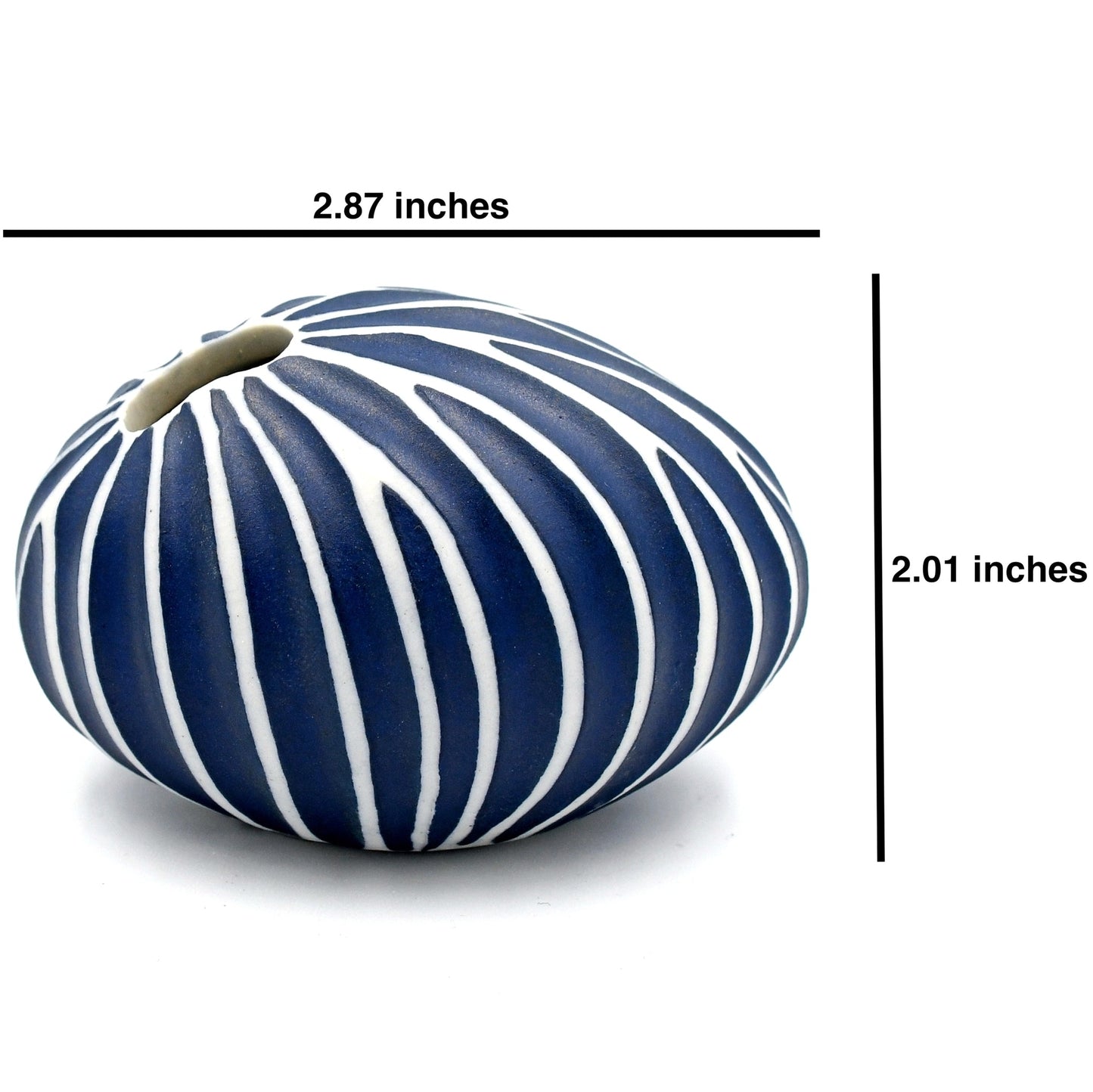 Blue and white striped vase with measurements on a white background