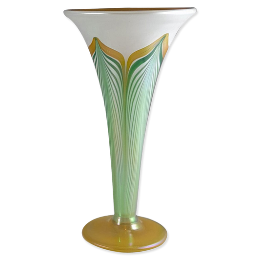 Decorative vase with green and gold design on a white background