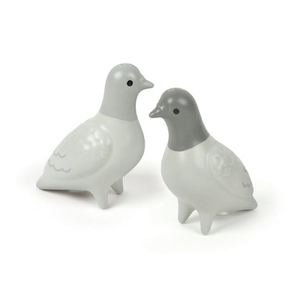 Two ceramic pigeon-shaped salt and pepper shakers on a white background