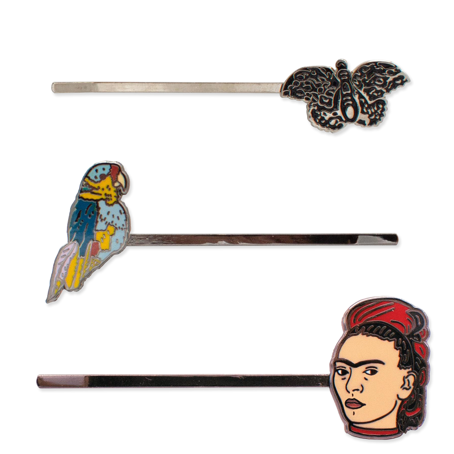 Set of hair pins with parrot, butterfly, and Frida Kahlo designs on a white background