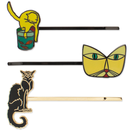 Set of three cat-themed hairpins on a white background