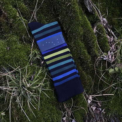Striped socks on a grassy background
