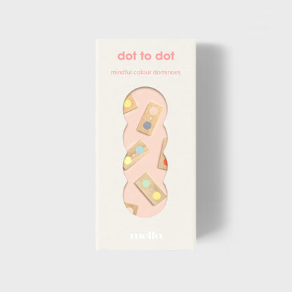 Packaging of 'dot to dot mindful colour dominoes' with a pink domino on a light gray background
