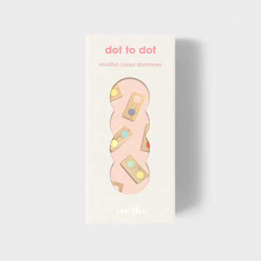Packaging of 'dot to dot mindful colour dominoes' with a pink domino on a light gray background