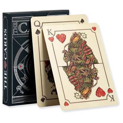 Playing cards with intricate designs and a black box labeled 'The Cards' on a white background