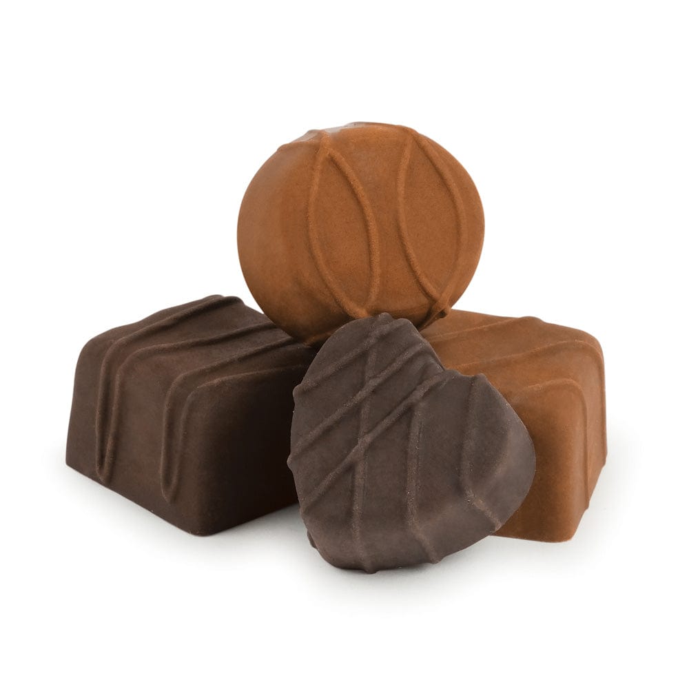 Three brown chocolate candy-shaped rubber erasers on a white background