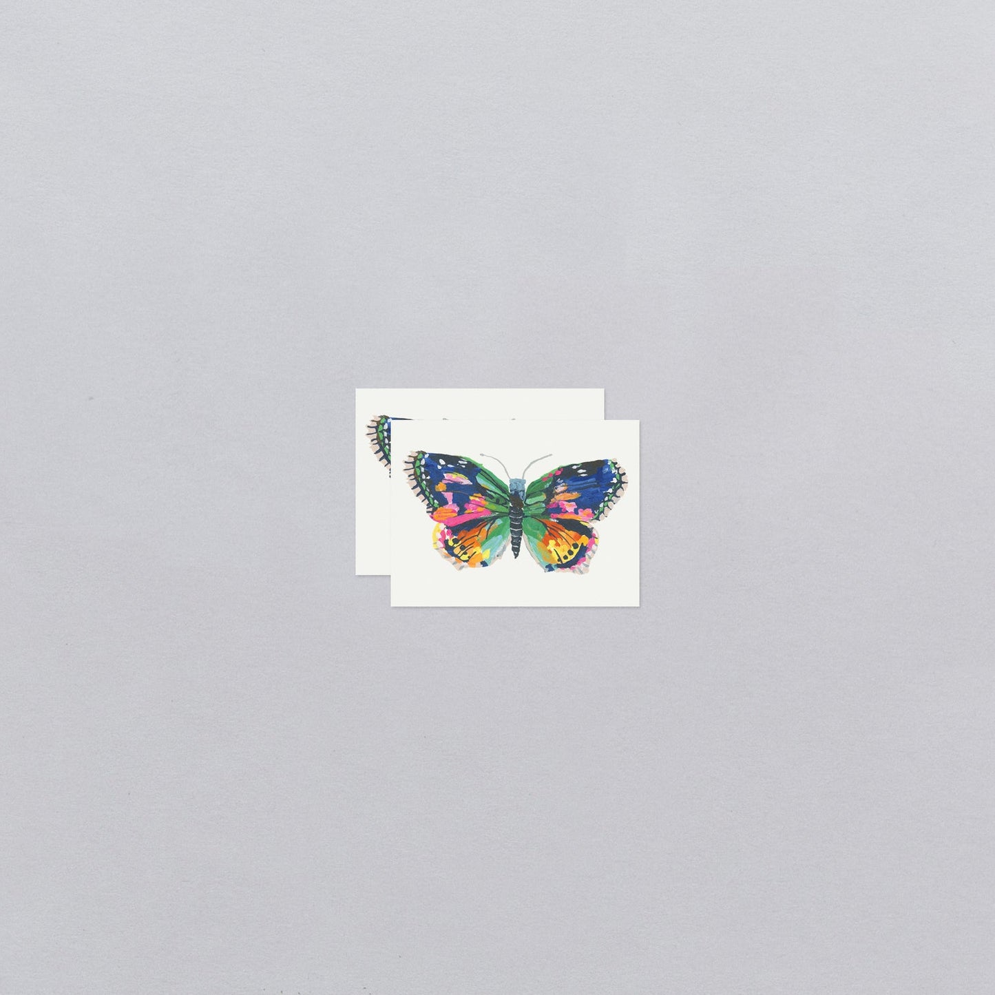 Colorful butterfly temporary tattoos with a gray background
