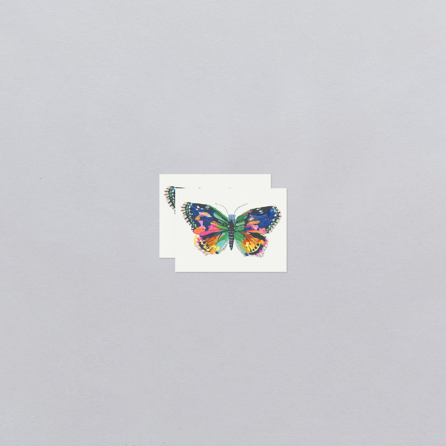 Colorful butterfly temporary tattoos with a gray background