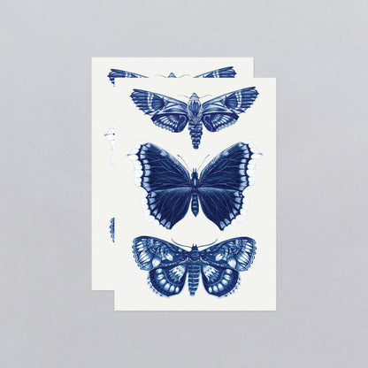 2 sheets of temporary tattoos featuring 3 blue moths