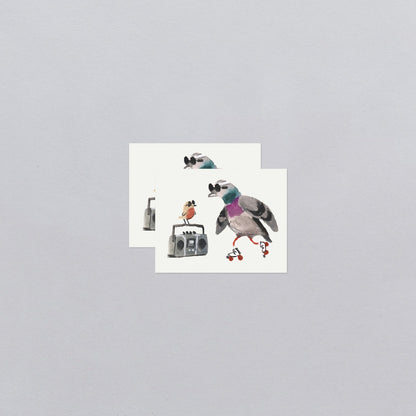 Two temporary tattoos with cartoon birds on a gray background