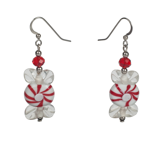 A pair of earrings featuring glass beads made to resemble red and white peppermint candies.